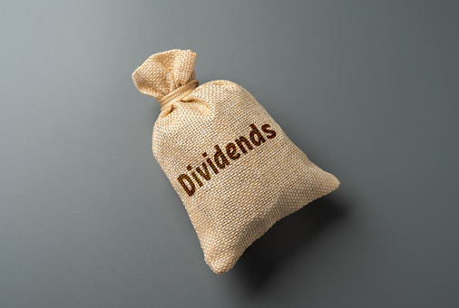 Bag with the word Dividends. Payment of dividends to officials. Maintain trust and financial integrity. Fair and equitable distribution