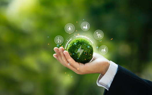 Innovation alternative or clean renewable energy from generator power solar, wind, hydro, geothermal, and biomass for eco-friendly to Sustainable Environment. Hand Holding a Green Globe with an icon