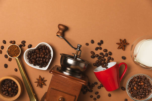 istock Ingredients for making coffee. Moka pot, Turkish coffee pots (cezve), coffee grinder with coffee beans, milk, sugar and spices on a white background. Drink preparation concept. Flat Lay.Copy space. 1979573682