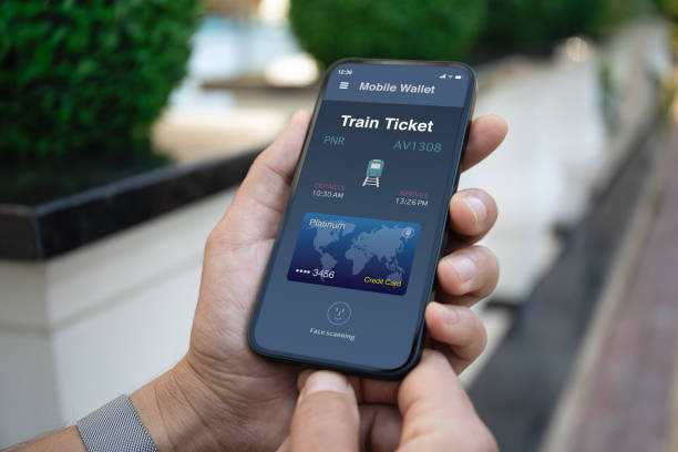 istock Male hand hold phone with train ticket application on screen 1979599959