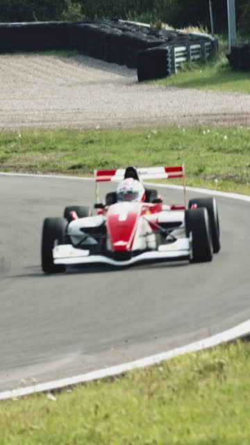 racing car driving on a racetrack
