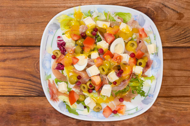 Boiled eggs, fresh tomatoes, and cottage cheese seasoned with spices create a nutritious and delicious breakfast option