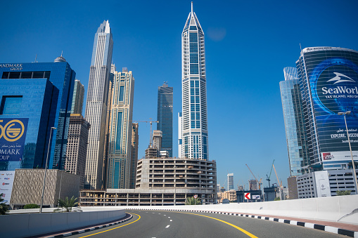 Dubai, UAE - March, 15. 2019 - futuristic skyscrapers, one different from the other, along the famous Sheikh Zayed Road in Dubai. Along the road is a partially ten-lane highway