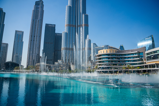 Dubai, UAE - December 1, 2023 : The Burj Khalifa or tallest structure building in the world with Dubai fountain view from Mall of Dubai, UAE. High quality photo