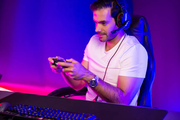 istock Streamer talking with team member players with joystick control game. Surmise. 1979667464