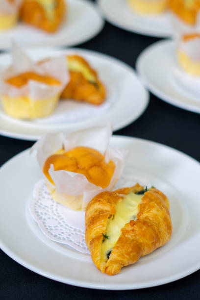 Image of camembert cheese on a mini croissant, french dessert at plate