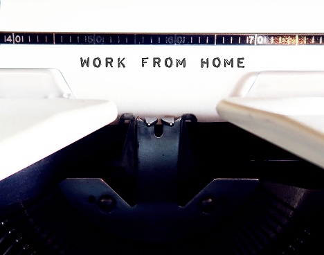 Vintage typewriter with text typed WORK FROM HOME - concept of staff working from home in pandemic time, remote flexible working which employee work remotely from anywhere