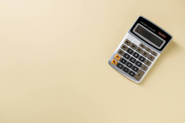 istock Top view of electronic calculator on yellow background 1979703793