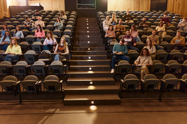 istock College students having an exam on a class at lecture hall. 1979762251