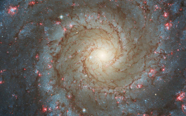 Face-on spiral galaxy, NGC 628. Bright galactic long-range captured imagery. Elements of this image furnished by NASA (observed by the Hubble telescope) Face-on spiral galaxy, NGC 628. Bright galactic long-range captured imagery. Elements of this image furnished by NASA (observed by the Hubble telescope) spiral galaxy stock pictures, royalty-free photos & images