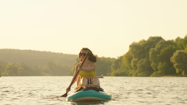 Merry Weekend In Nature, Young Women Paddleboarding In River In Summertime, SUP Touring