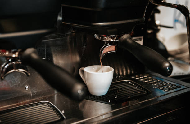istock Espresso machine pouring fresh black coffee in cup 1979782070