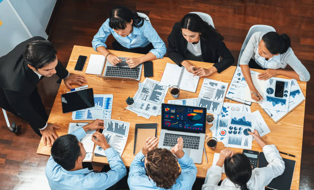 istock Wide top view diverse analyst team analyzing financial data. Habiliment 1979792619
