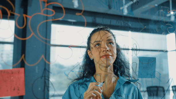 istock Young hispanic employee writing on colorful sticky notes. Closeup. Manipulator. 1979794207
