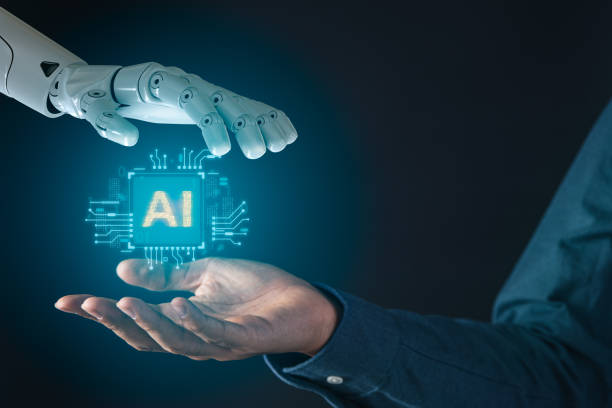 istock Robot hand and businessman hand holding digital screen of AI artificial intelligence for futuristic technology and information technology concept 1979796906