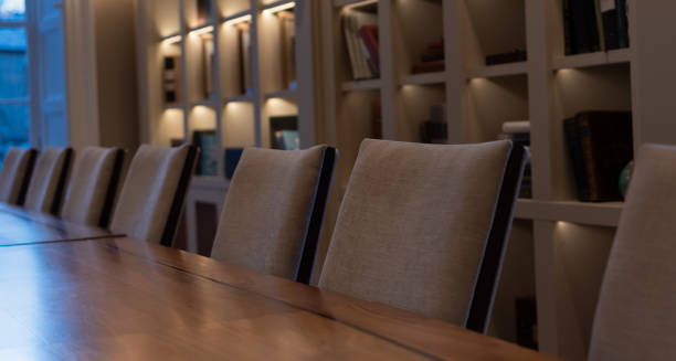 istock Row of chairs at conference room table 1979799563