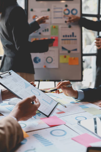 istock Group of Business people meeting creative planning and development strategy using graphs, charts, presented at company sales strategy marketing meeting. 1979807013