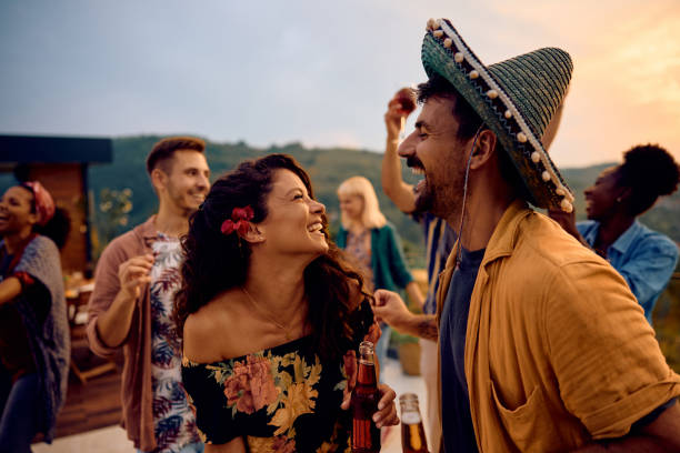 istock Carefree couple dancing and having fun on a summer party. 1979812836