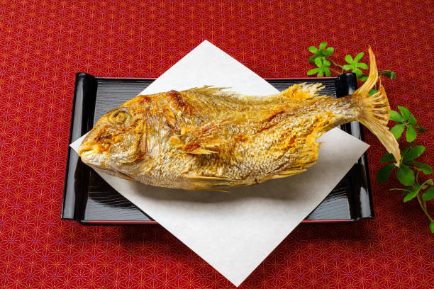 Whole grilled sea bream with salt