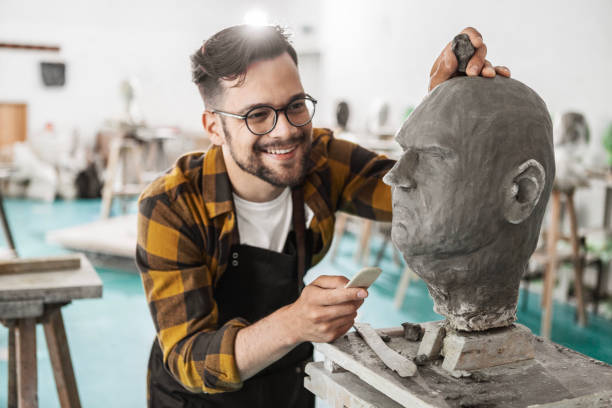 istock Artist Molding Clay into a Head Shape 1979835468