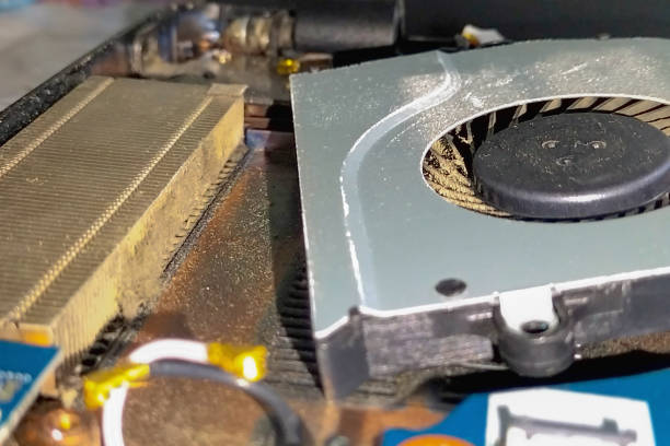istock Laptop CPU thermal board cooling fan blades that are clogged with dust. Technical nuances in the maintenance of smart devices and computers 1979850819