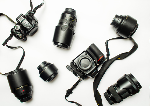 Many Lens and cameras are on isolated white background