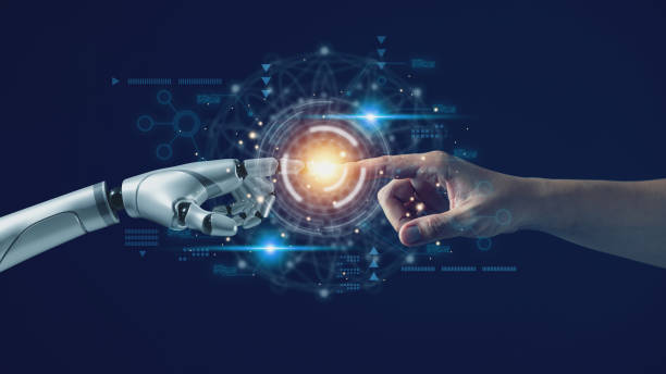 istock AI technology concept, Machine Learning, Robot hand touching human hand. to connect with global data refers to how humans can create and control artificial intelligence, AI innovation and technology. 1979889196