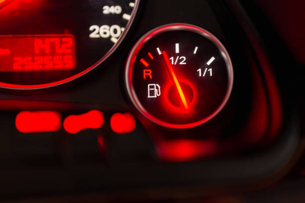istock Fuel gauge with speedometer red indicator at empty level.Close-up car dash board petrol meter, fuel gauge, with over full gasoline in car. Clip.Gasoline sensor 1979891837