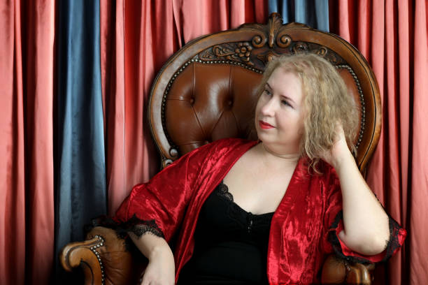 istock An older pretty blonde curly woman 1979898625