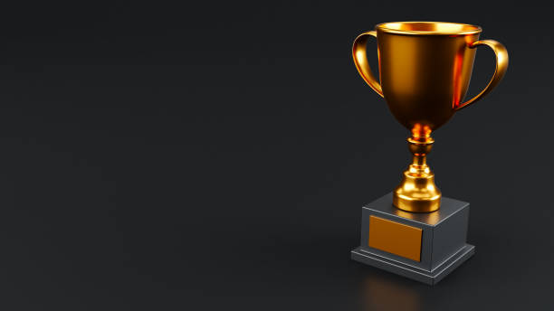 istock Winner Gold Trophy isolated on dark background, trophy cup isolated 1979912463