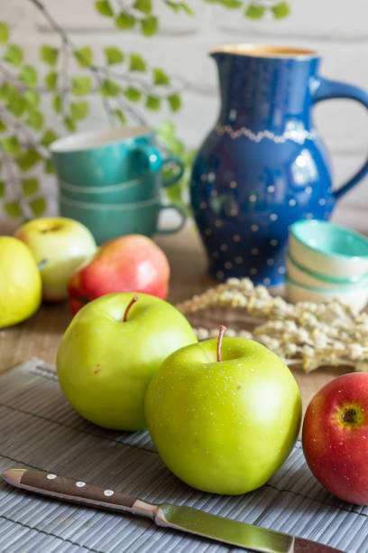 Fruits on a table with blue white jugs and decoration