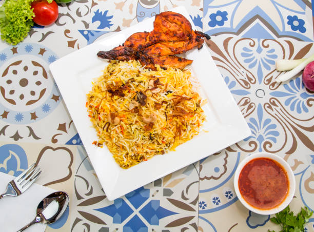 istock Chicken Biryani rice with fried onion and cashew nuts served in dish isolated on table top view of arabic food 1979920342