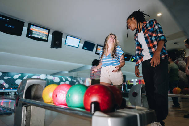 istock Friends talking while bowling at a bowling club 1979947720