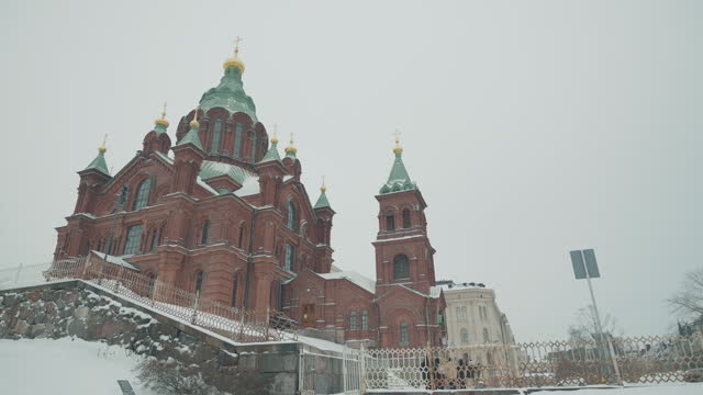 Tourists Travel To Uspensky Cathedral In Helsinki, Finland