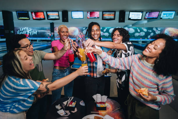 Friends toasting at a bowling club