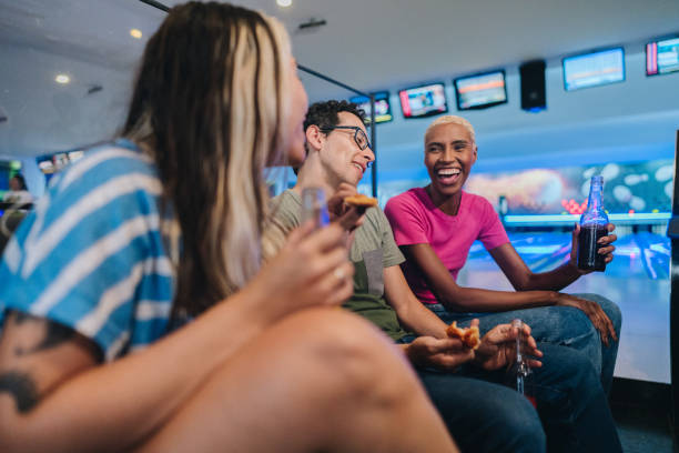istock Friends talking while eating at a bowling club 1979957711
