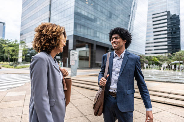 istock Coworkers talking outdoors 1979965490