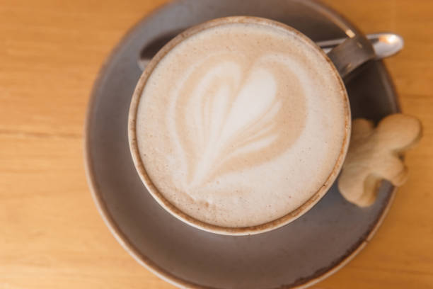 istock Coffee on a wooden table in a cafe, drawings on coffee. 1979967150