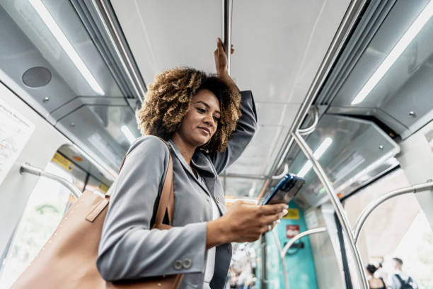 istock Businesswoman using the mobile phone on the train 1979968209
