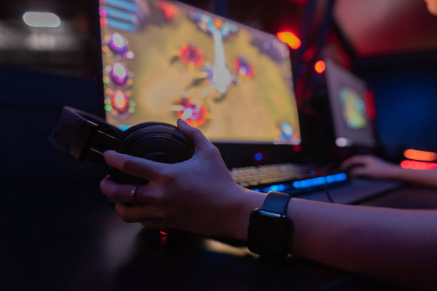 istock Gamer holding headset start tournament final match 1979982569