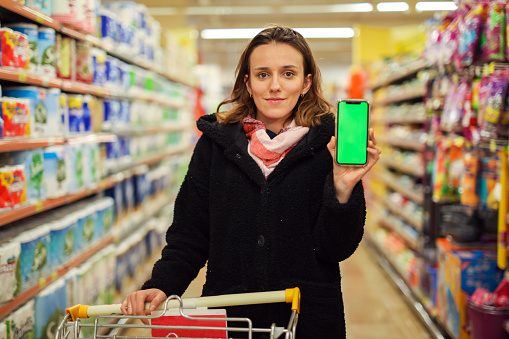 Crazy Discounts, Woman Holding a Green Screen Phone, Supermarket Shopping