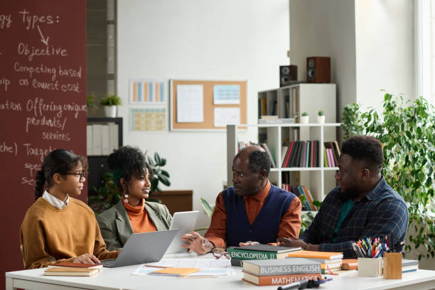 istock Senior Black Professor Talking to Group of Students in Class 1980009319