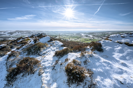 A rural winter Staffordshire Peak District, UK landscape scene. Panoramic view of Hen Cloud from The Roaches.