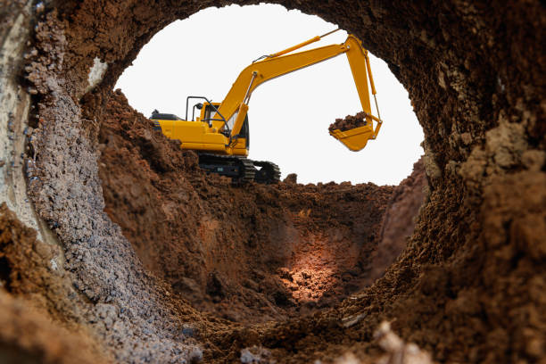 istock Crawler excavator are digging soil in the tunnel construction site. 1980031006