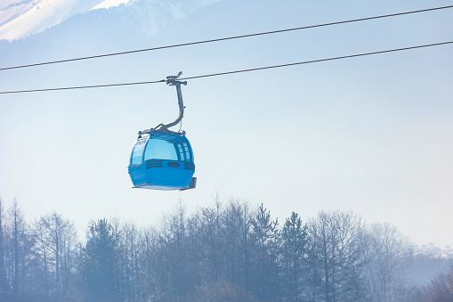 Bansko, Bulgaria Bulgarian winter ski resort panorama with gondola lift cabin, Pirin mountain peaks view