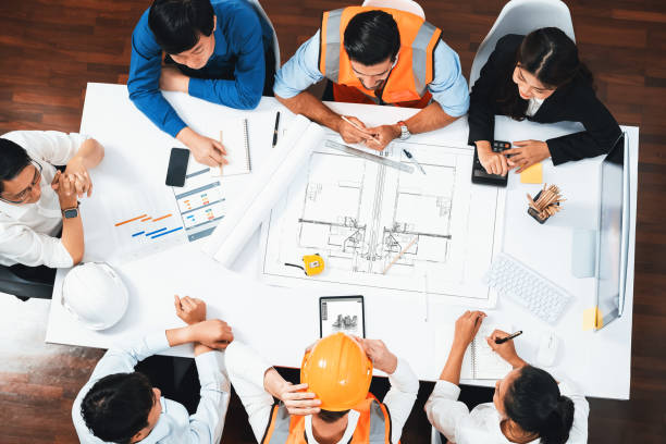 istock Diverse group of civil engineer and client working on architect. Prudent 1980035771