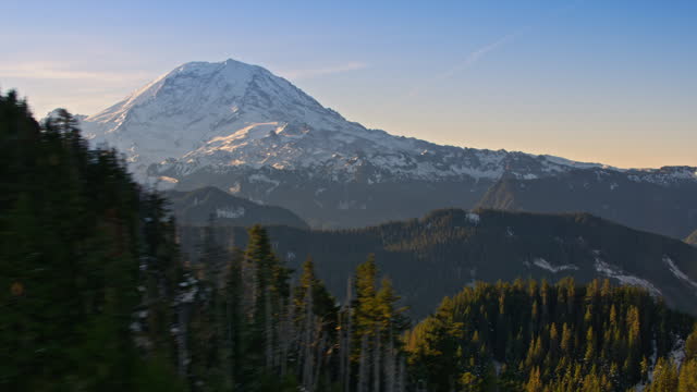 AERIAL Along a mountain ridge with a view of Mount Rainier, Washington