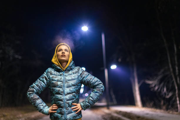 istock Young woman taking a break after running 1980047648