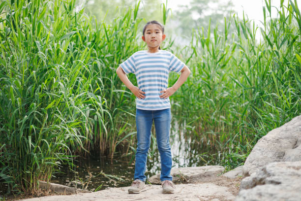 Litter girl Standing on Water's Edge