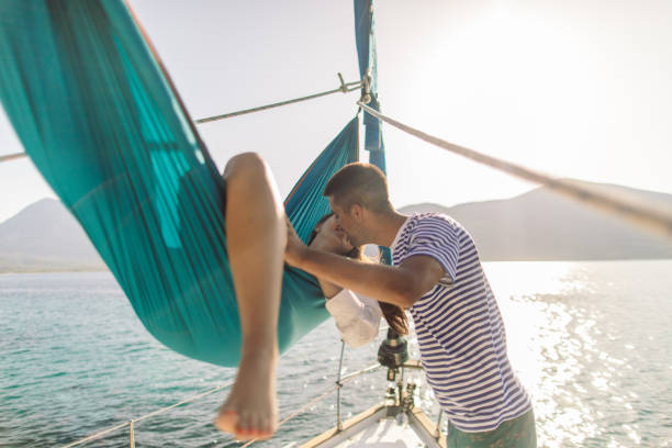 istock Young couple on sailboat 1980087308